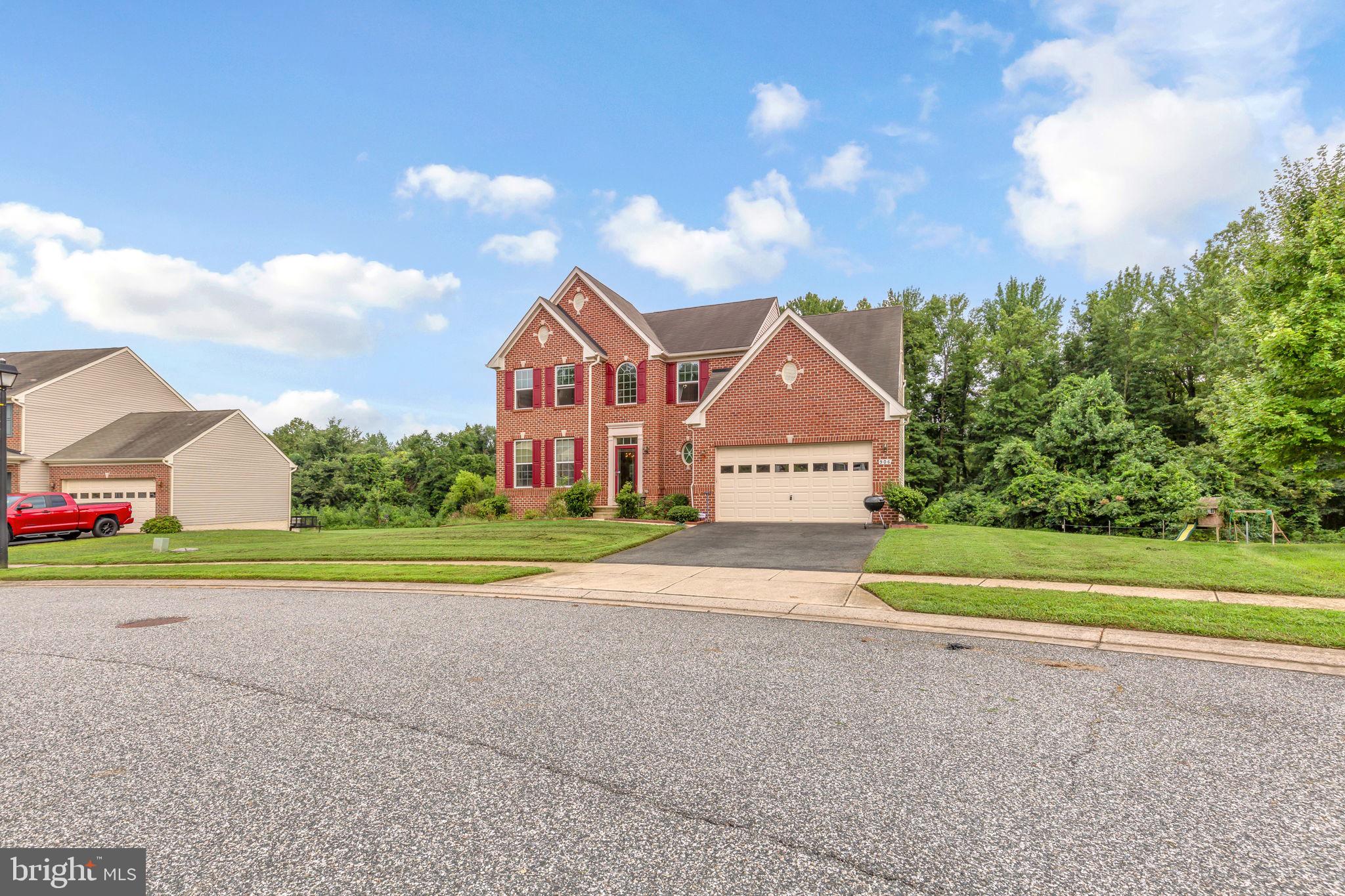 906 Gladway Road Baltimore, MD 21220 - Photo 42 of 52 a front view of a house with a yard and garage