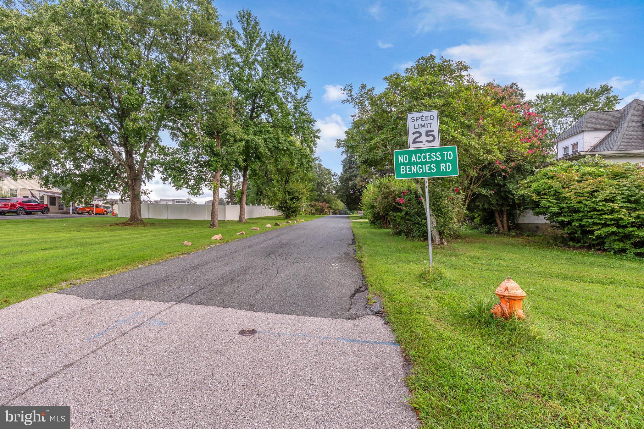 906 Gladway Road Baltimore, MD 21220 - Photo 43 of 52 a sign that is sitting in the grass with large trees