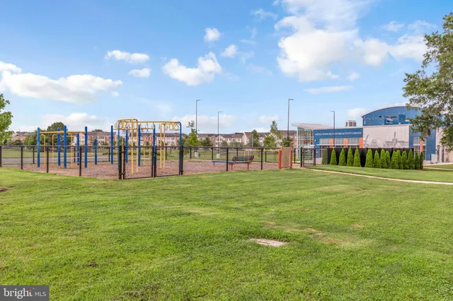 a front view of building with yard