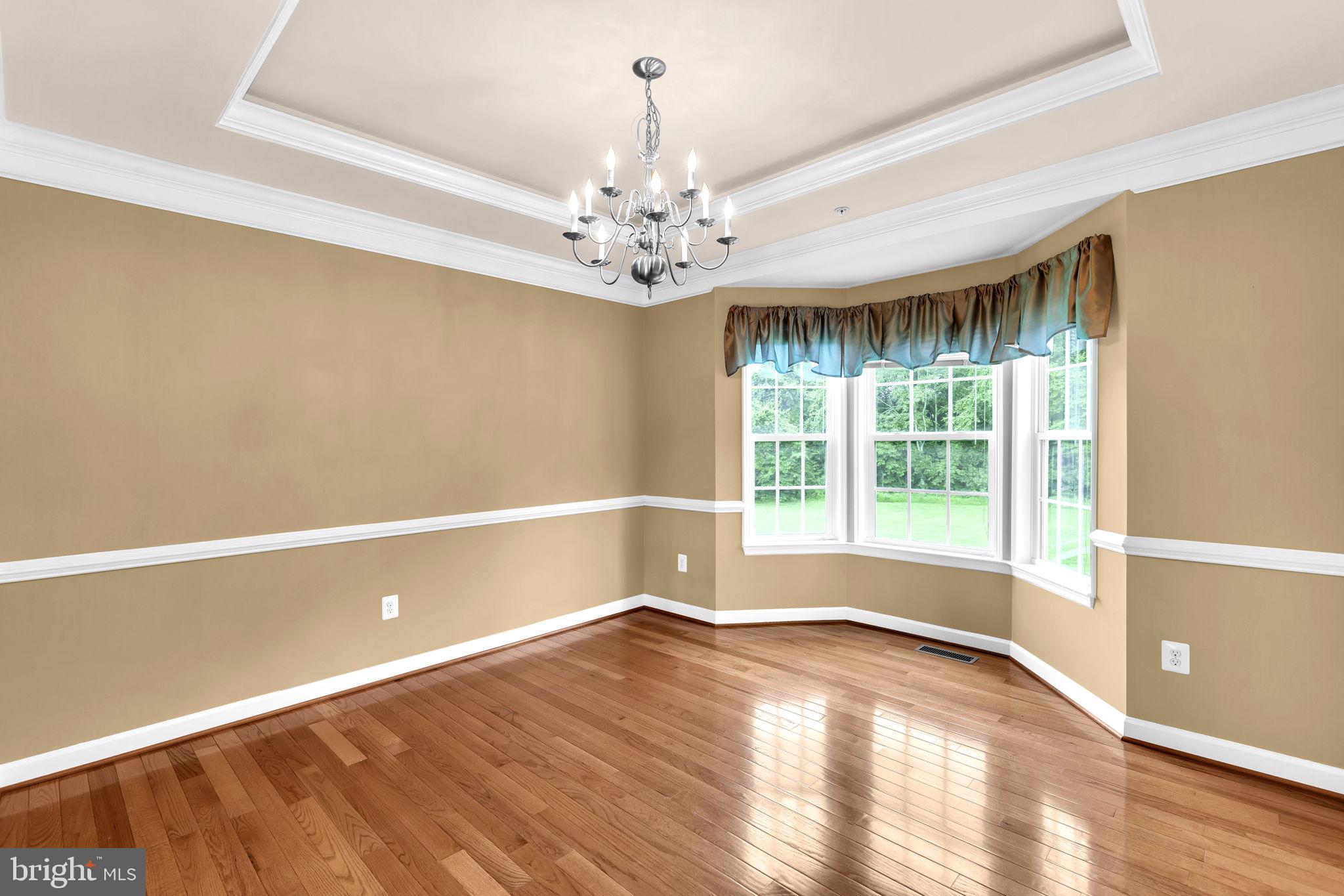 906 Gladway Road Baltimore, MD 21220 - Photo 5 of 52 a view of an empty room with a window