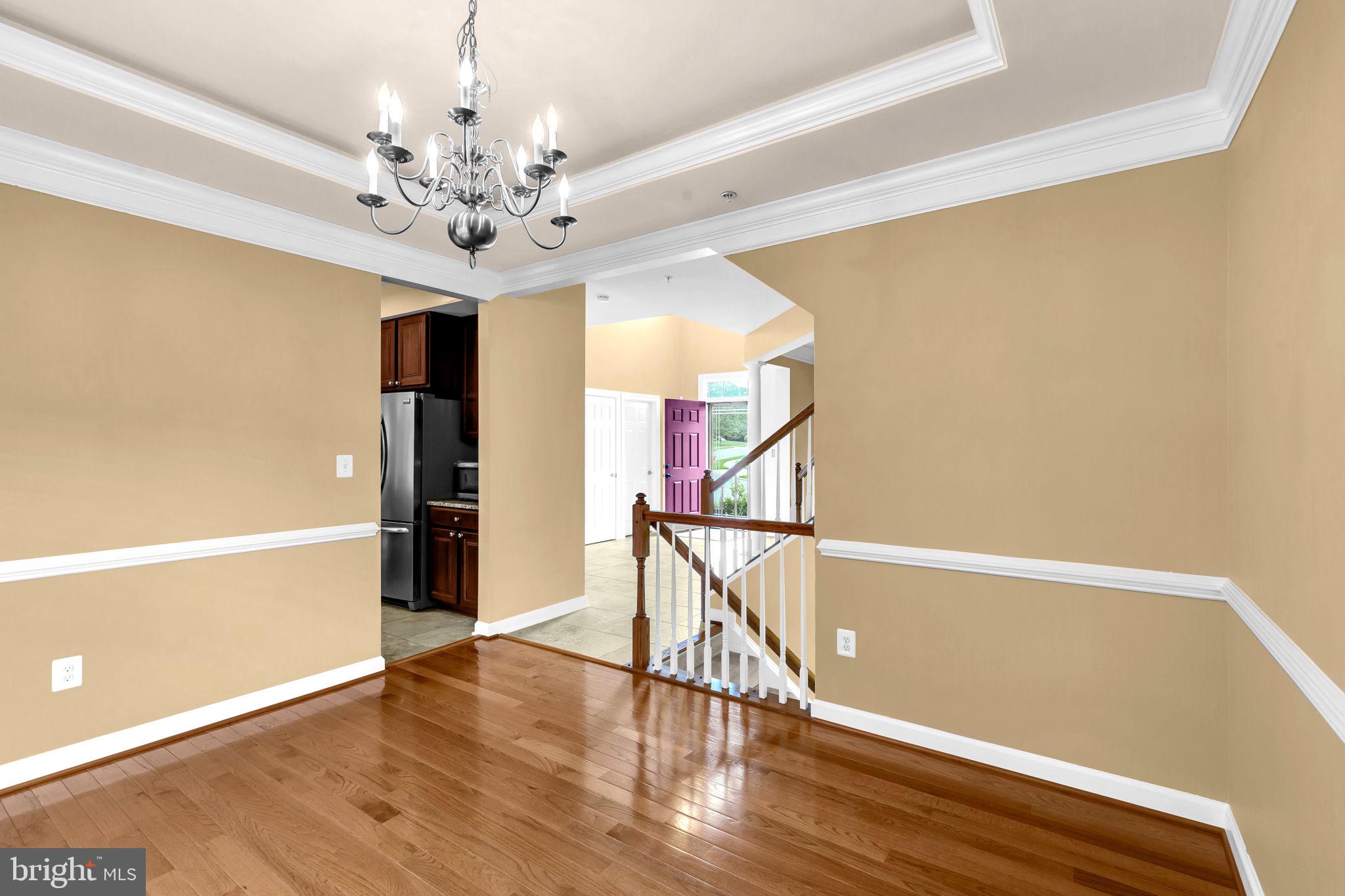 906 Gladway Road Baltimore, MD 21220 - Photo 6 of 52 a view of an empty room with window and wooden floor