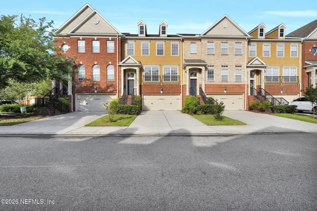 a view of multiple houses with a street
