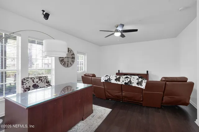 a living room with furniture and a window
