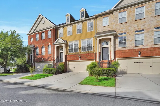 a front view of a building with garden
