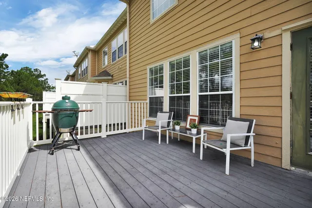 a wooden bench sitting in front of a building