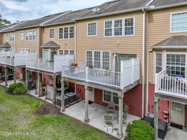 a view of a brick building with many windows