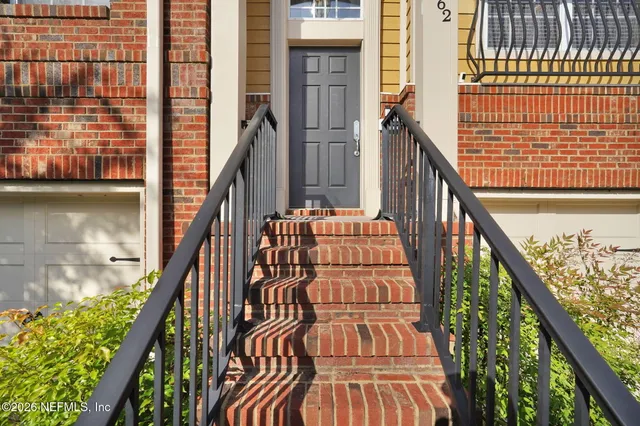 a view of balcony with wooden floor and lake view