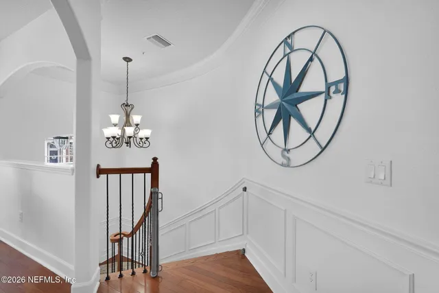 a view of an entryway with wooden floor