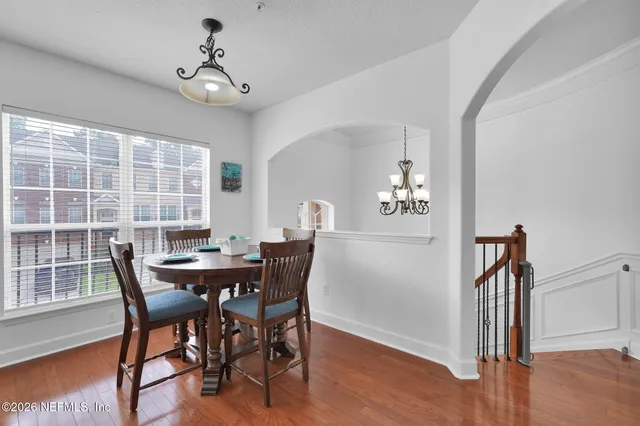 a view of a dining room with furniture window and wooden floor