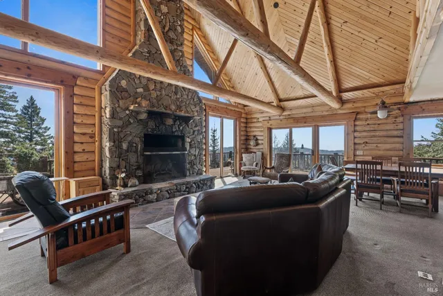 a living room with furniture a fireplace and blue walls