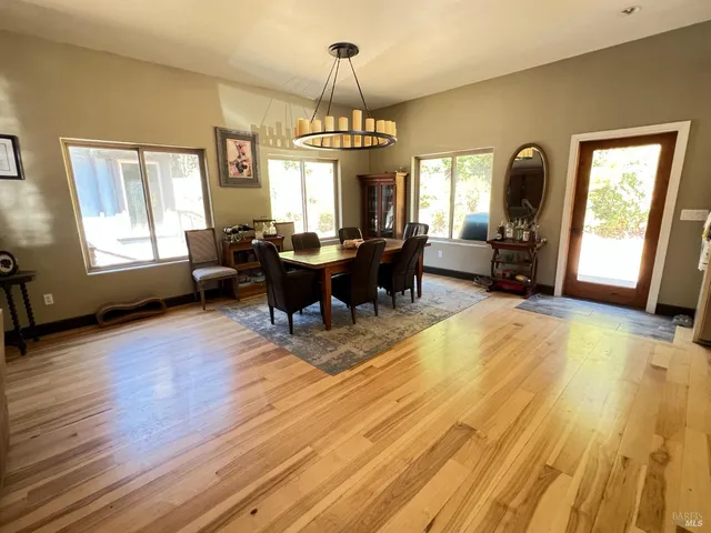 a living room with fireplace furniture and a window