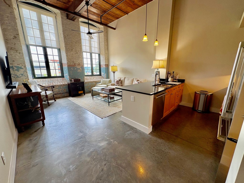 1201 Front Avenue Columbus, GA 31901 - Photo 12 of 16 a living room with couches and flat screen tv