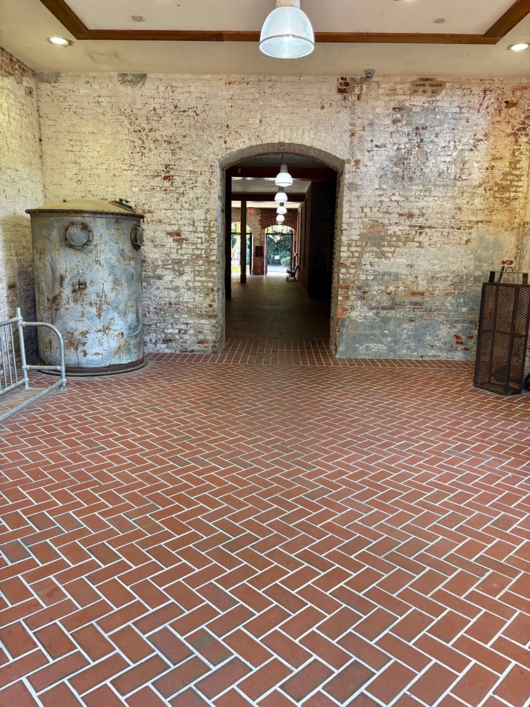1201 Front Avenue Columbus, GA 31901 - Photo 4 of 16 a view of a livingroom with wooden floor and a fireplace