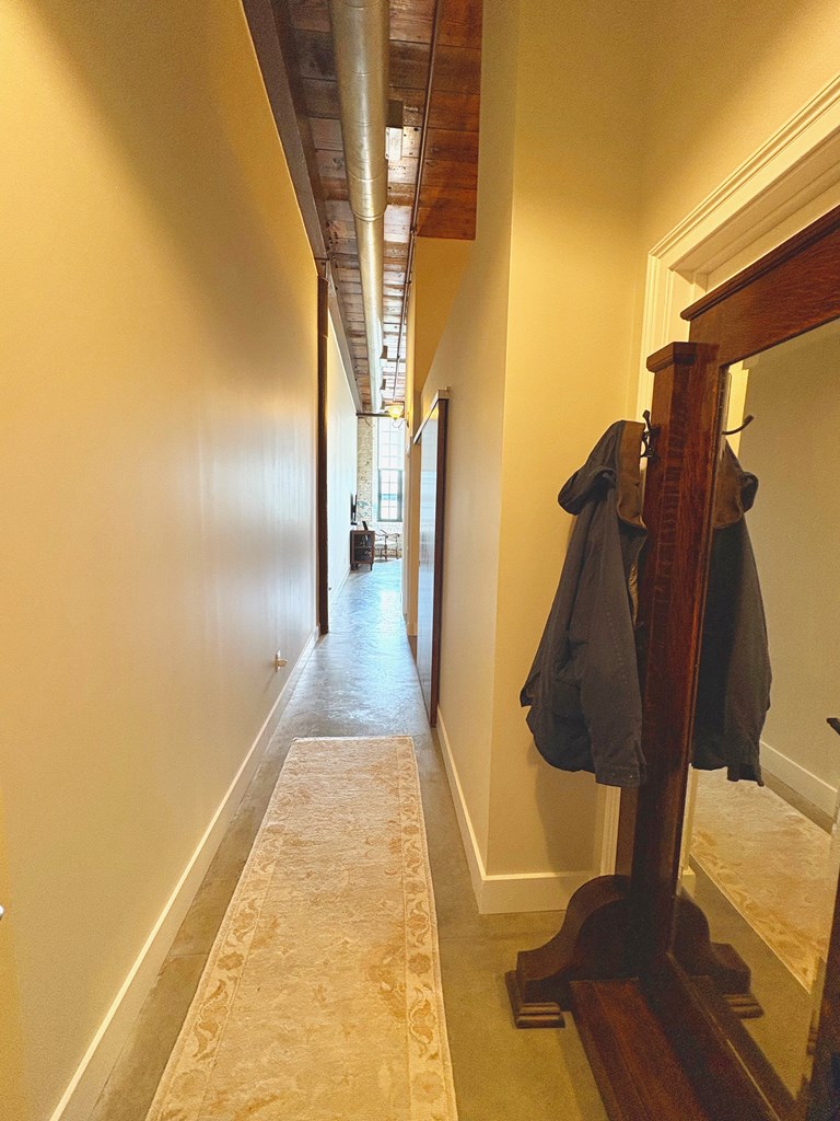 1201 Front Avenue Columbus, GA 31901 - Photo 8 of 16 a view of walk in closet with rug