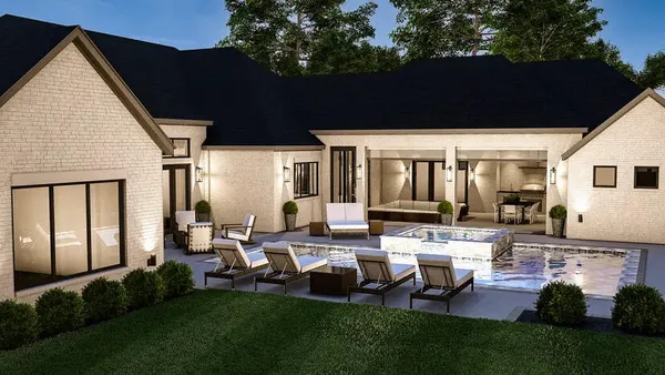 a couple of benches sitting in front of a house