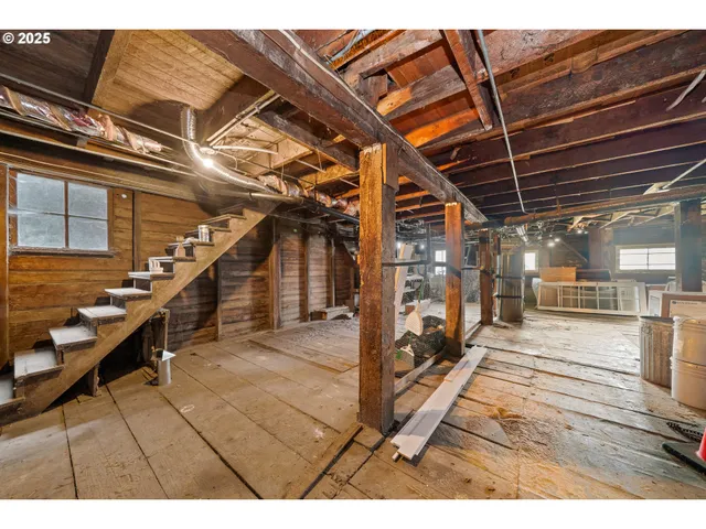 a view of a gym with wooden floor