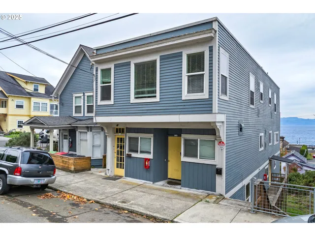 a view of building with car parked