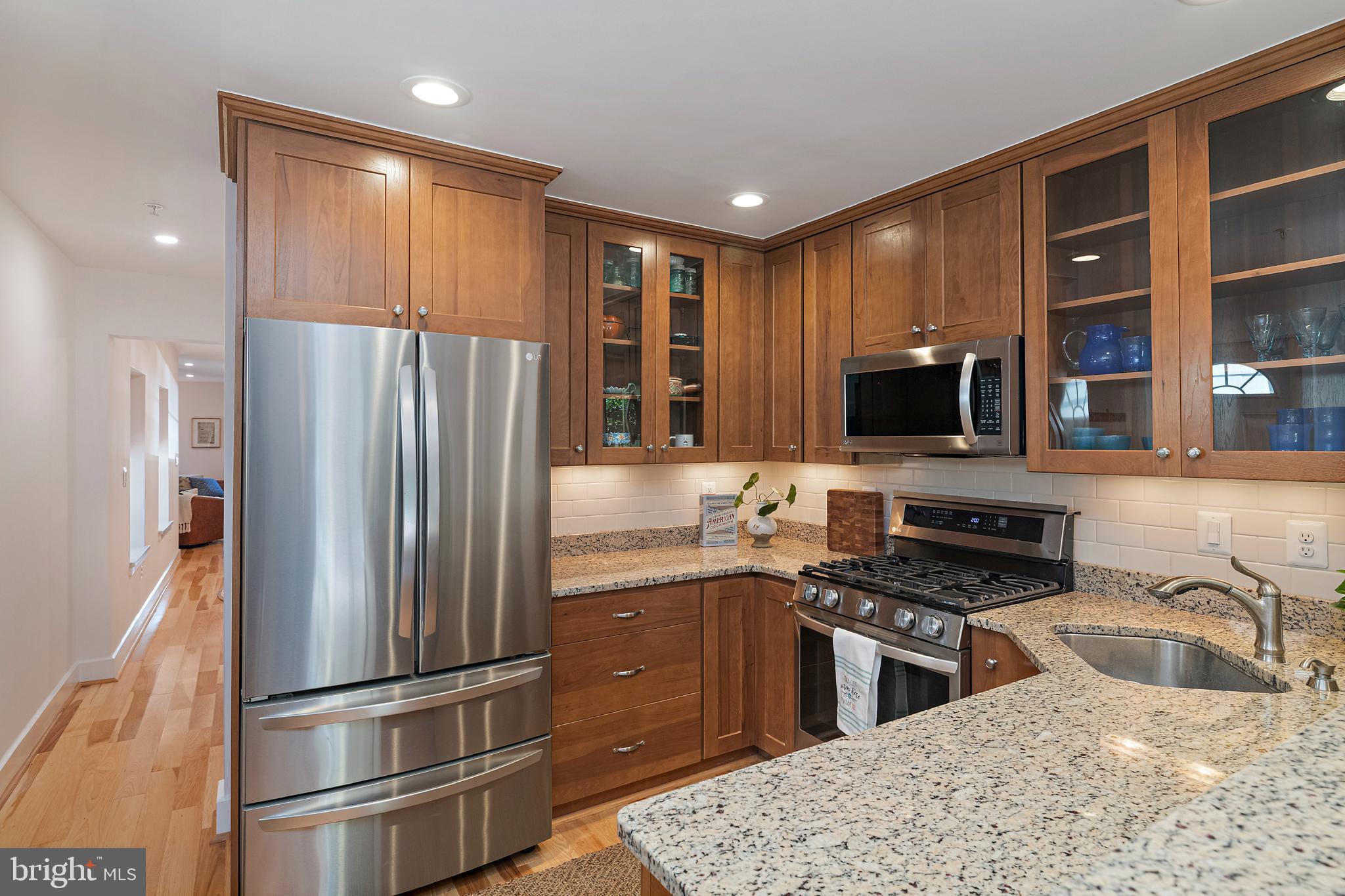 237 Hanover Street Annapolis, MD 21401 - Photo 23 of 48 a kitchen with stainless steel appliances granite countertop a refrigerator stove and microwave