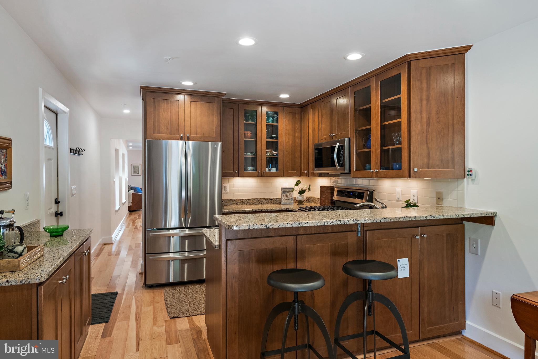 237 Hanover Street Annapolis, MD 21401 - Photo 24 of 48 a kitchen with stainless steel appliances granite countertop a refrigerator and a stove top oven