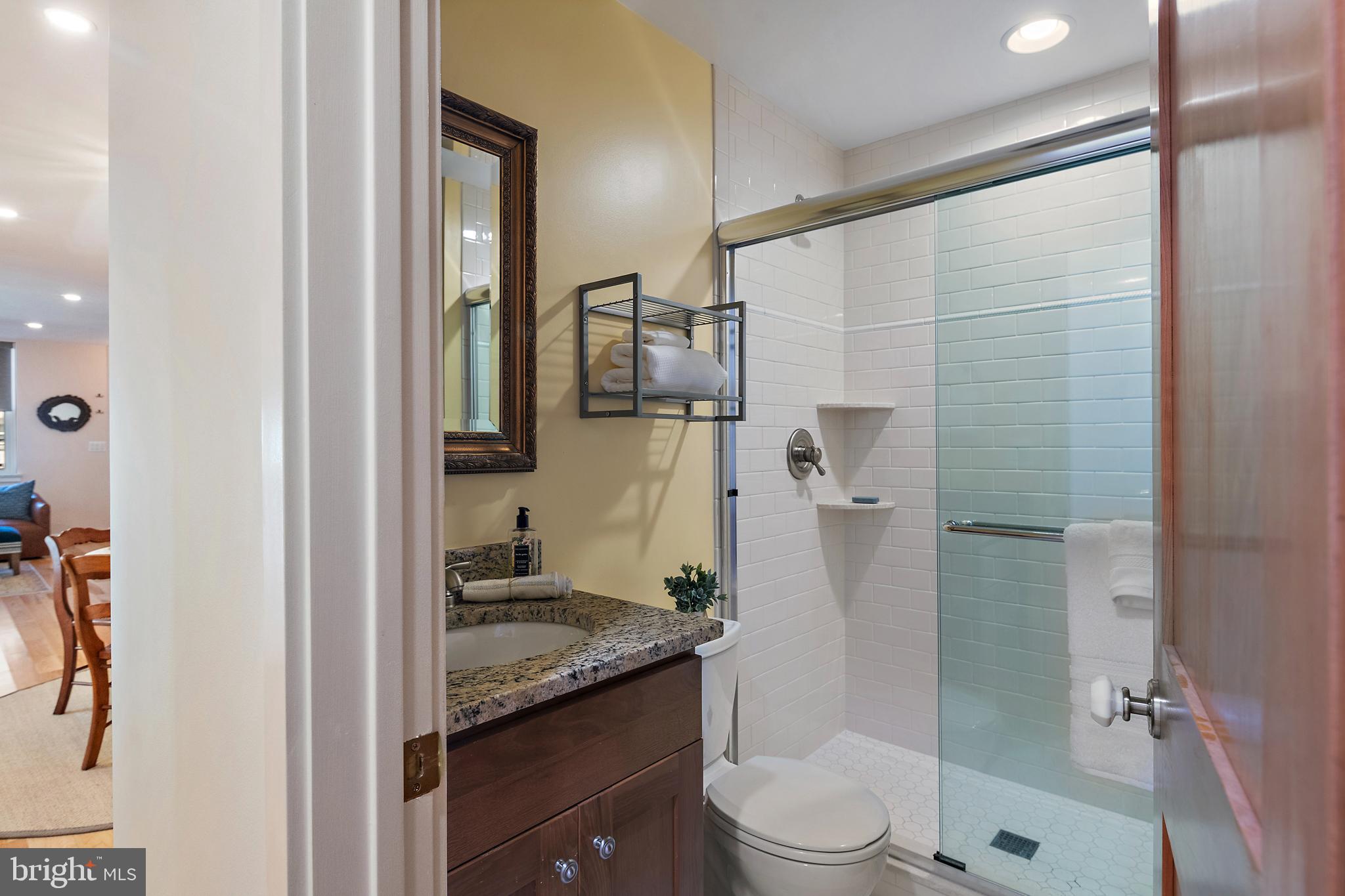 237 Hanover Street Annapolis, MD 21401 - Photo 30 of 48 a bathroom with a granite countertop sink toilet and shower