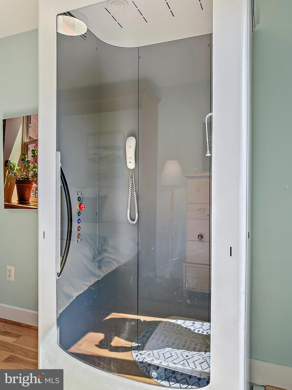 237 Hanover Street Annapolis, MD 21401 - Photo 45 of 48 a bathroom with a glass shower door