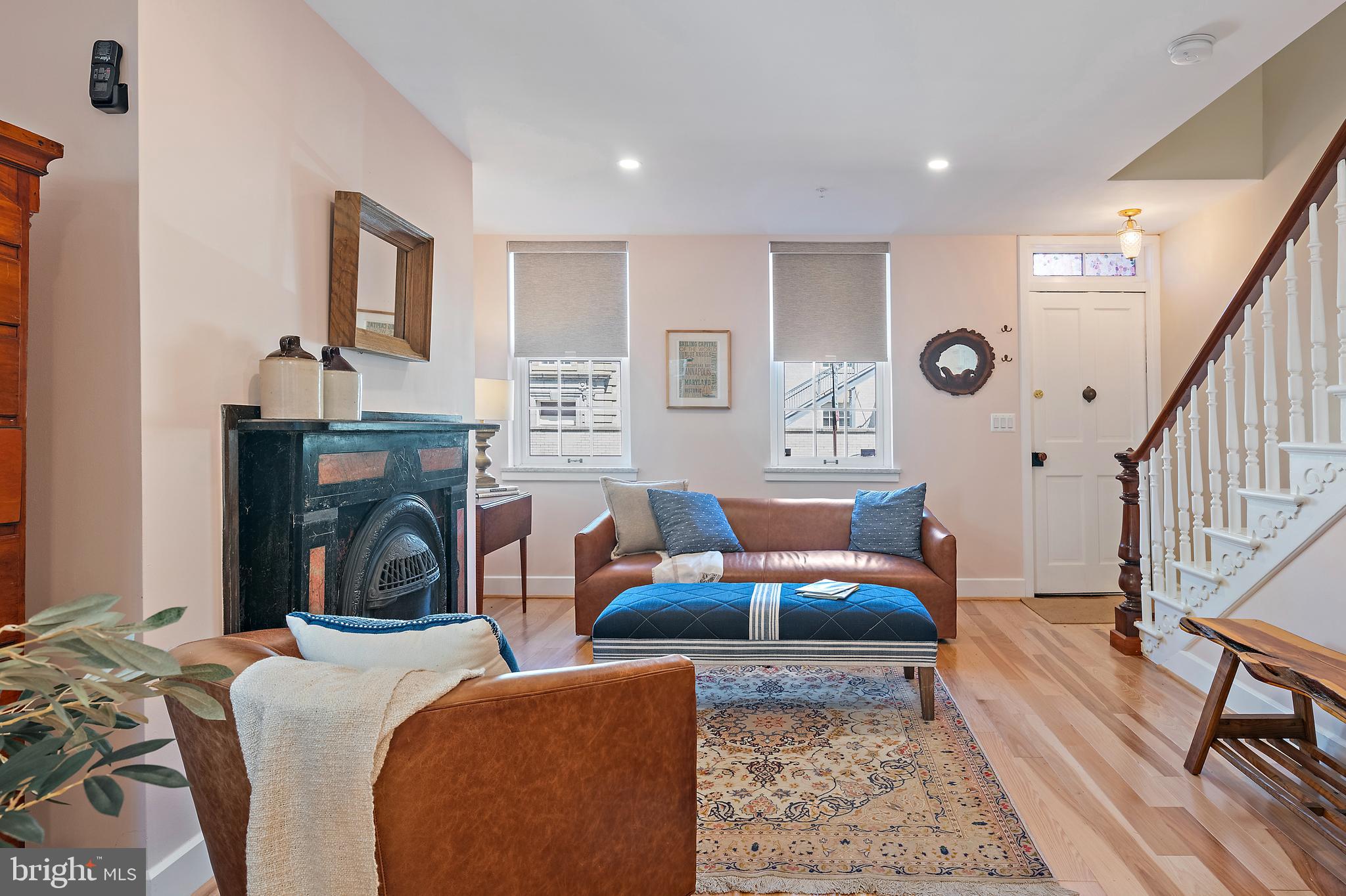 237 Hanover Street Annapolis, MD 21401 - Photo 10 of 48 a living room with furniture a fireplace and a table