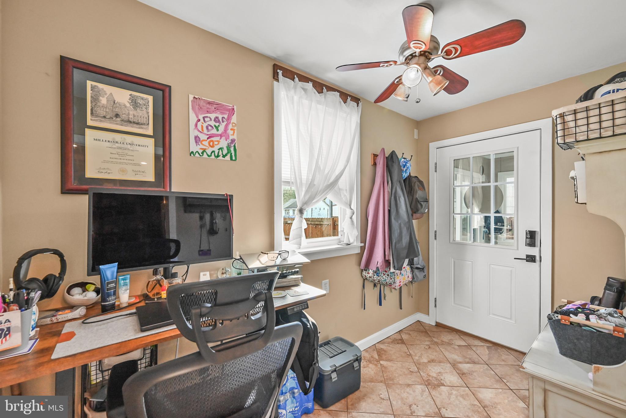 206 Ruth Avenue Hanover, PA 17331 - Photo 18 of 45 a living room with furniture a flat screen tv and a window