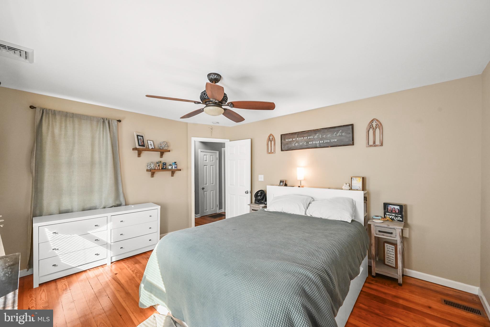 206 Ruth Avenue Hanover, PA 17331 - Photo 21 of 45 a bedroom with a bed and a chandelier