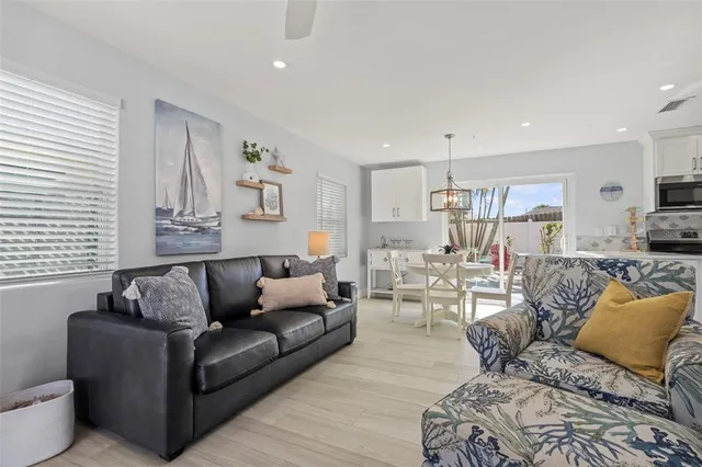 a view of a dinning table and chairs in the balcony