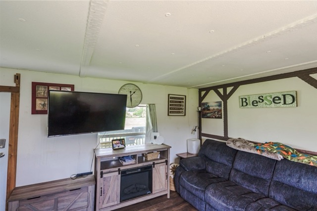 835 County Road 182 Marlin, TX 76661 - Photo 12 of 27 a living room with furniture and a flat screen tv