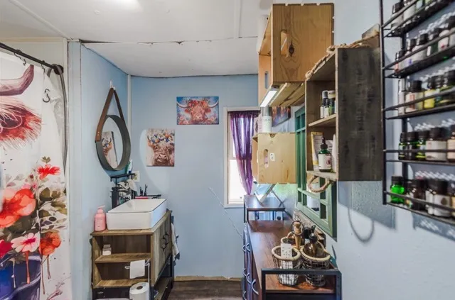 a view of a big house in middle of the field