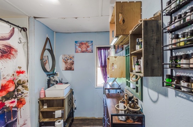 835 County Road 182 Marlin, TX 76661 - Photo 15 of 27 a living room with furniture a bookshelf and a window