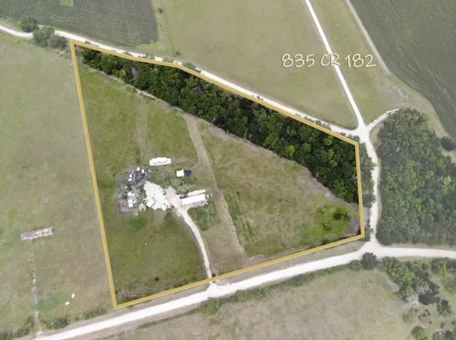 a view of a backyard with a sitting area