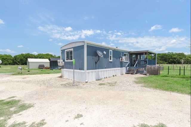 835 County Road 182 Marlin, TX 76661 - Photo 7 of 27 a view of a house with a yard