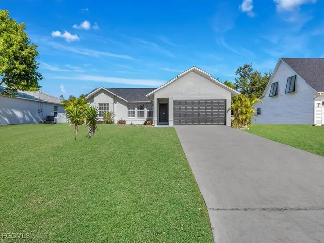 a view of a house with a yard