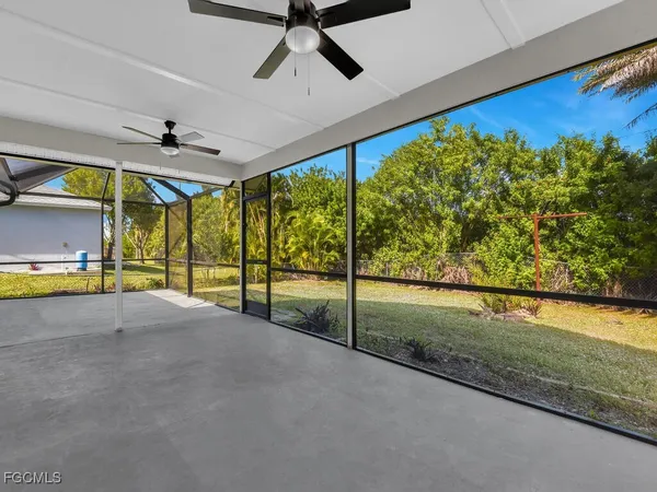 a view of a yard with palm trees