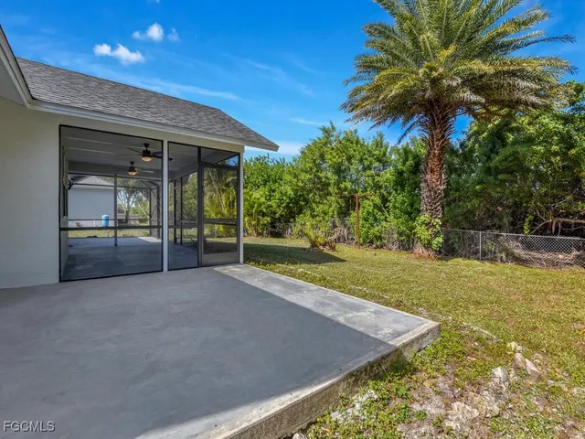 a house with palm tree in front of it