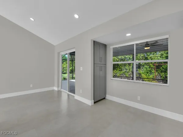 a view of an empty room with a window