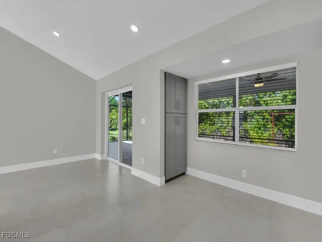 a view of an empty room with a window