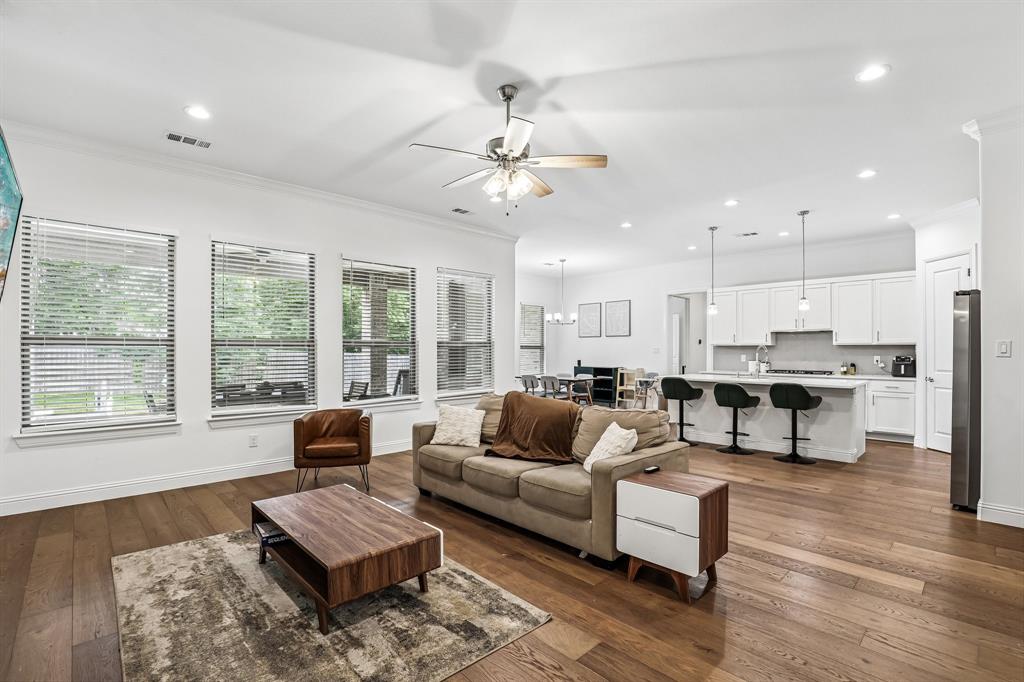 515 West Laureland Road Dallas, TX 75232 - Photo 6 of 32 a living room with furniture and a large window with wooden floor