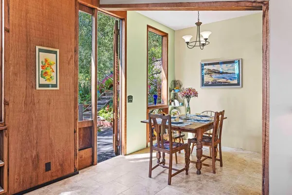 a view of a dining room with furniture window and outside view