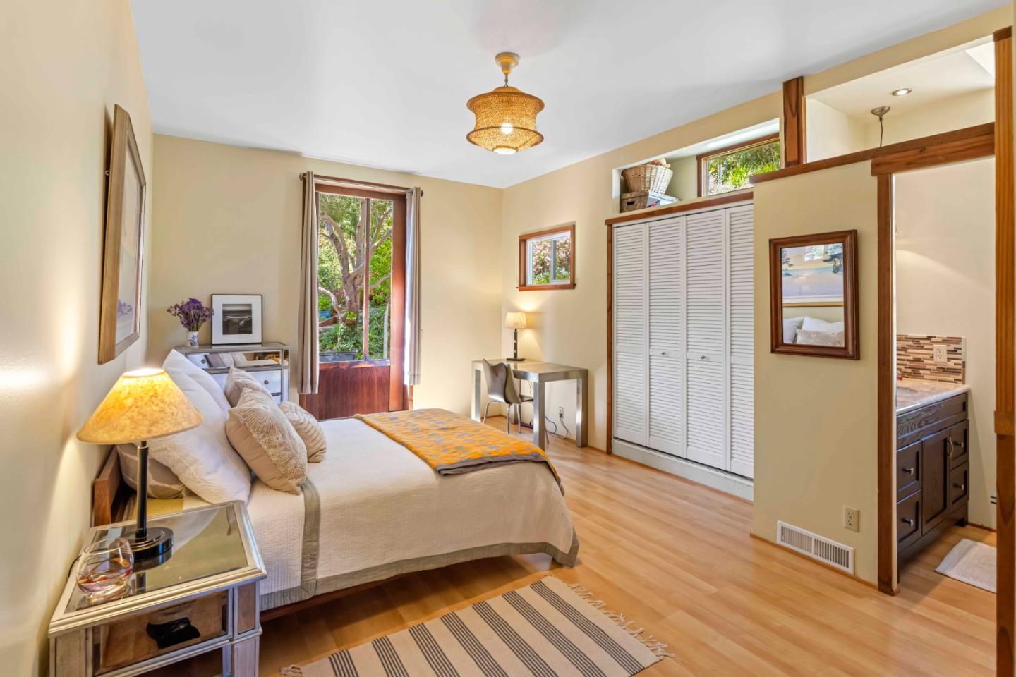 3405 Rio Road Carmel, CA 93923 - Photo 23 of 40 a bedroom with a bed dresser and a window