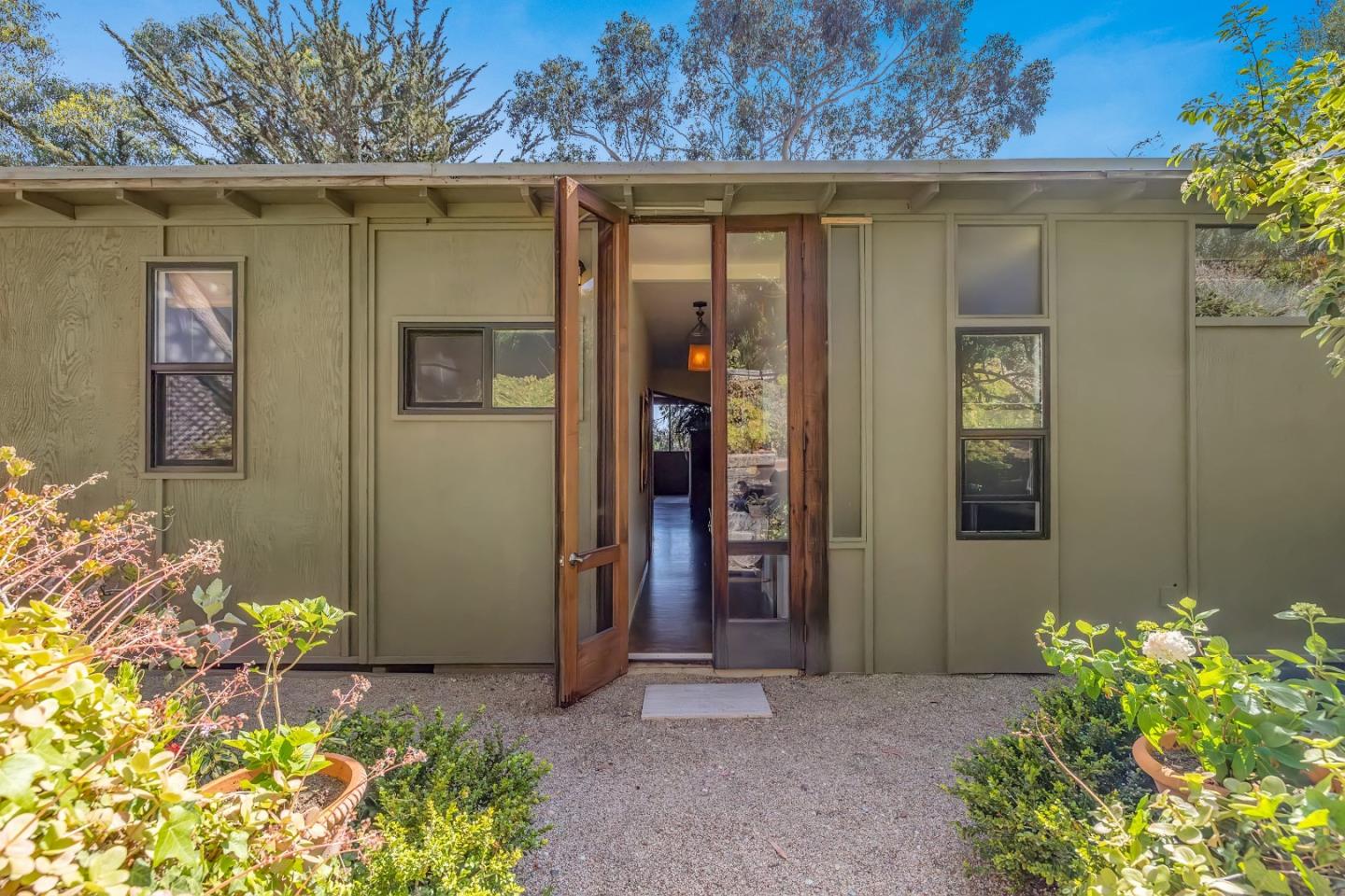 3405 Rio Road Carmel, CA 93923 - Photo 26 of 40 a front view of a house with a yard