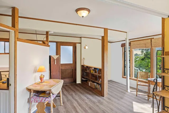 a bedroom with furniture and wooden floor