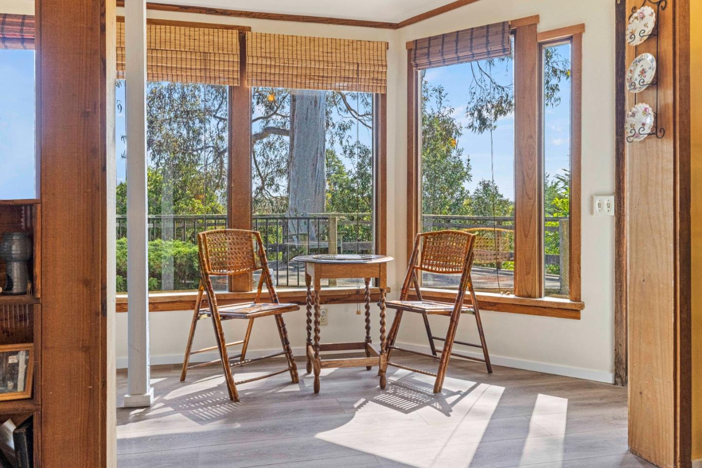 3405 Rio Road Carmel, CA 93923 - Photo 28 of 40 a glass door and chair sitting in front of a window