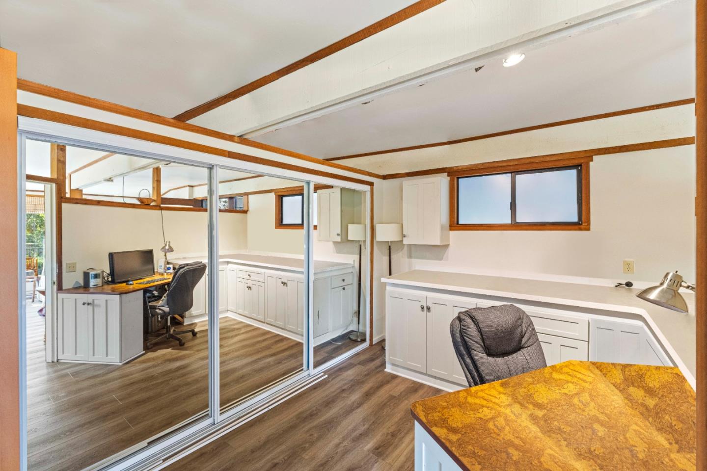 3405 Rio Road Carmel, CA 93923 - Photo 29 of 40 a bedroom with furniture and wooden floor