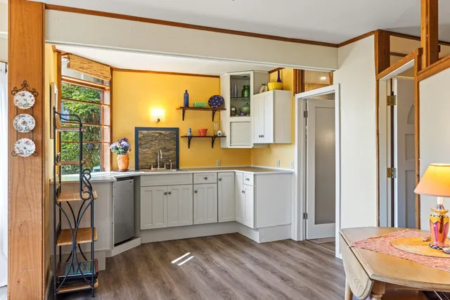 a kitchen with a sink and a window