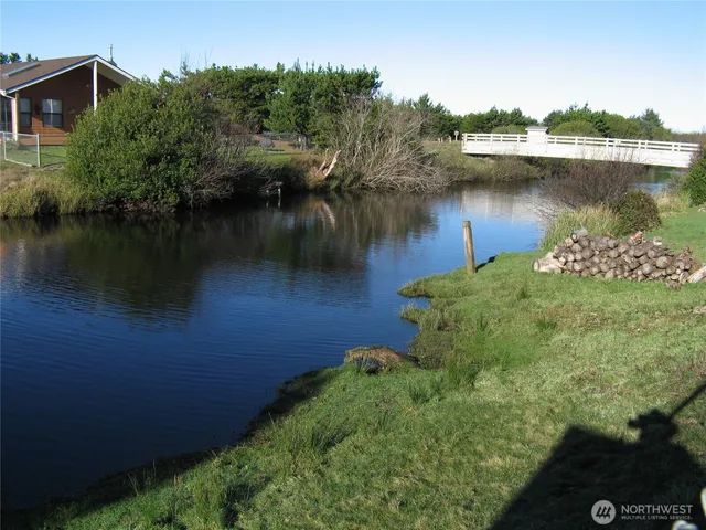 an aerial view of a house lake view and boat