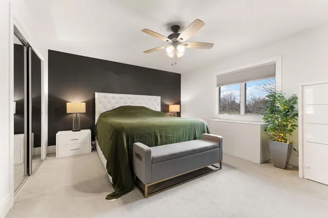 a spacious bathroom with a sink a toilet and mirror
