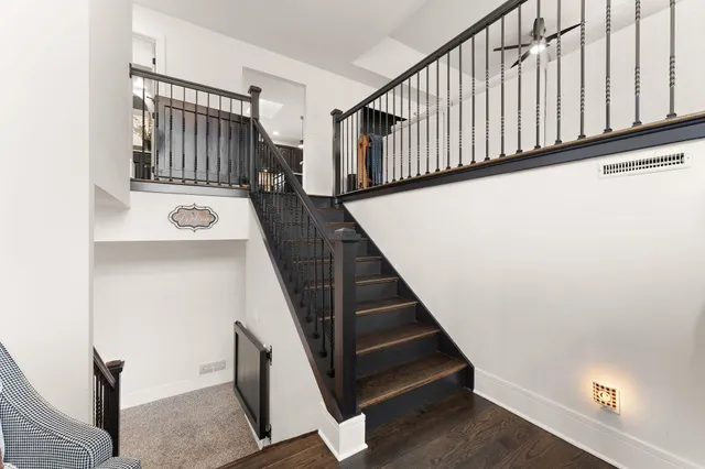 a view of game room with wooden floor and furniture